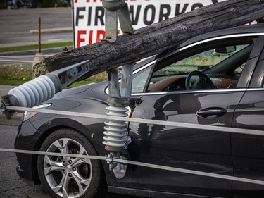 OTTAWA -- Ottawa and the surrounding area was hit with a destructive storm Saturday. Clean up was well underway with hydro, community members and first responders, Sunday, May 22, 2022. Merivale Road near viewmount drive was closed with lines down on cars that were trapped under the lines Sunday. 

ASHLEY FRASER, POSTMEDIA