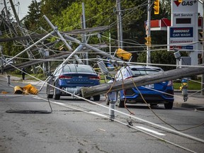 Merivale Road near Viewmount Drive was closed on Sunday with downed power lines on cars.