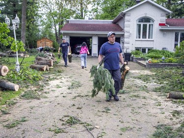 The Pineglen area off of Merivale Road was heavily damaged by Saturday's devastating storm. Hastings Utilities Contracting Ltd., a contractor along with Hydro Ottawa were working on clearing lines in the area and moving the trees and rubble. Iain Tyrrell worked to clean up fallen trees in his yard Monday evening. Tyrrell and his family took possession of the home he loved because of the beautiful mature trees the day the tornado ripped through the capital in 2018.