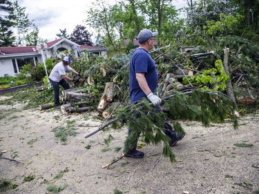 The Pineglen area off of Merivale Road was heavily damaged by Saturday's devastating storm. Hastings Utilities Contracting Ltd., a contractor along with Hydro Ottawa were working on clearing lines in the area and moving the trees and rubble. Iain Tyrrell worked to clean up fallen trees in his yard Monday evening. Tyrrell and his family took possession of the home he loved because of the beautiful mature trees the day the tornado ripped through the capital in 2018.