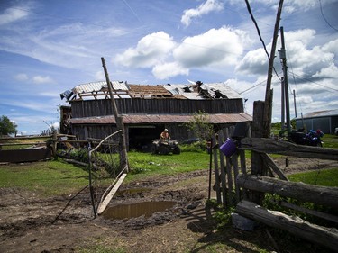 Allan Scott heads out on the four-wheeler to get back to work on the farm in White Lake, Monday, May 23, 2022.