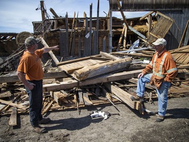 Allan Scott and his son-in-law Matt LaRose  talk about the damage to the White Lake farm, Monday, May 23, 2022.