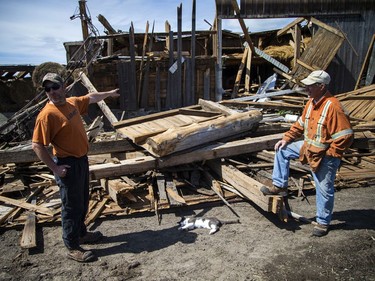 Allan Scott and his son-in-law Matt LaRose  talk about the damage to the White Lake farm, Monday, May 23, 2022.