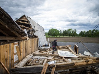 James Campbell, owner of Campbell Farms in White Lake, lost the barn that was built in 1909 and survived five generations, during Saturday's devastating storm that ripped through the region.