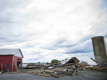 James Campbell, owner of Campbell Farms in White Lake, lost the barn that was built in 1909 and survived five generations, during Saturday's devastating storm that ripped through the region.