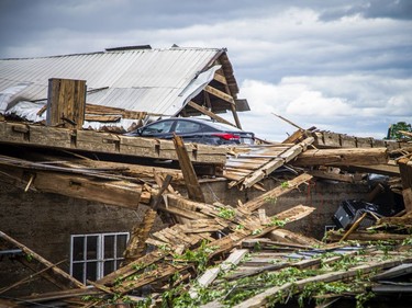 James Campbell, owner of Campbell Farms in White Lake, lost the barn that was built in 1909 and survived five generations, during Saturday's devastating storm that ripped through the region.