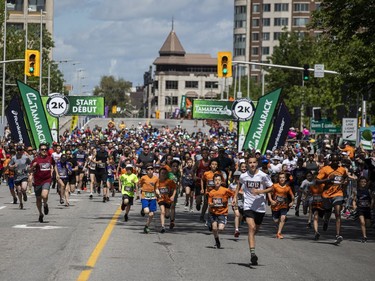OTTAWA --  Runners take off from the start line of the 2K race at Tamarack Ottawa Race Weekend, Saturday, May 28, 2022.