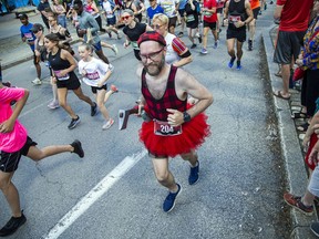 It's not all serious for Ottawa Race Weekend.  Nick Jankowski, a Lumberjack Challenge competitor, raced in the 5K race at Tamarack Ottawa Race Weekend, Saturday, May 28, 2022.