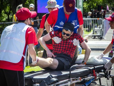 OTTAWA --  A man was helped by medical staff at the finish line at Tamarack Ottawa Race Weekend, Sunday, May 29, 2022.