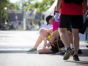 OTTAWA --  A finisher gets medical attention at the marathon at Tamarack Ottawa Race Weekend, Sunday, May 29, 2022.