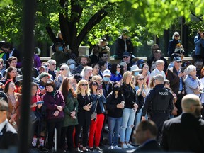 On May 18, 2022, a crowd gathered along Elgin Street to see the Duchess of Cornwall and Prince of Wales offering garlands and flowers at the National War Memorial in Ottawa.