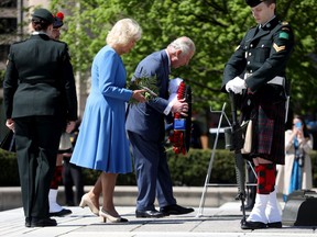 The Duchess of Cornwall and Prince of Wales dedicated garlands and flowers to the National War Memorial in Ottawa on May 18, 2022.