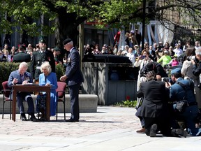 The Duchess of Cornwall and Prince of Wales will sign the book at the National War Memorial in Ottawa on May 18, 2022.