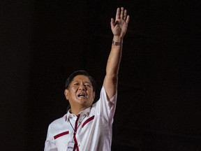 Ferdinand "Bongbong" Marcos Jr. waves to supporters during his last campaign rally before the election on May 07.