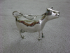 Silver cow creamer.