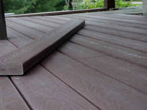 The fake wood grain pattern on this composite deck board won't be fooled by anyone, but it still looks great. Today's composite deck materials come in a variety of colors and textures.