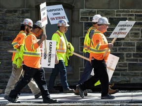 Striking Carpenters Union members picketed along Wellington Street on May 11, 2022