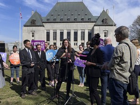Campaign Life Coalition's youth co-ordinator Josie Luetke addresses the media Wednesday outside Canada's Supreme Court.