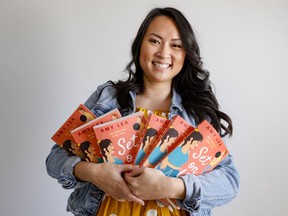 Local writer Amy Lea with her recently published romantic comedy Set on You.