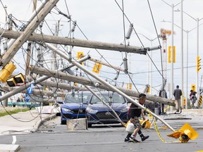 The aftermath of the May 21 storm is seen on Merivale Road May 24.