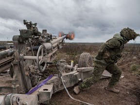 Soldiers from the Royal Canadian Artillery School fire an M777 howitzer during training in 2018.