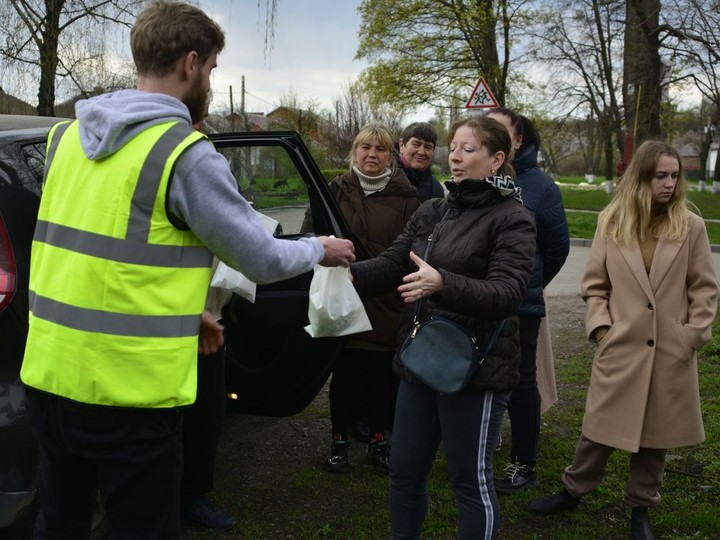  A volunteer with Mission Kharkiv hands out supplies in Ukraine.