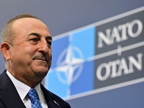 Turkish Foreign Minister Mevlut Cavusoglu arrives for an informal meeting of NATO Foreign Ministers on the conflict in Ukraine on May 14, 2022 in Berlin. (Photo by John MACDOUGALL / AFP) (Photo by JOHN MACDOUGALL/AFP via Getty Images)