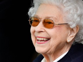 Britain's Queen Elizabeth reacts as she watches horses competing on the second day of the Royal Windsor Horse Show and Platinum Jubilee Celebration in Windsor, Britain, May 13, 2022.