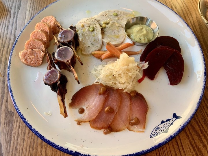  Clockwise fom top left, salmon summer sausage, tuna bone marrow, cod tongue mortadella, assorted pickles and cured tuna loin made up the charcuterie platter at Le Poisson Bleu on Somerset Street West.