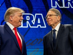 Former U.S. President Donald Trump greets CEO and Executive vice president of the National Rifle Association (NRA) Wayne LaPierre during the National Rifle Association annual convention at the George R. Brown Convention Center on May 27, 2022 in Houston, Texas.