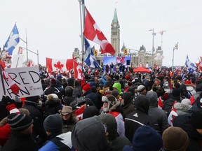 Protesters gather near Ottawa's Parliament Hill, on February 12, 2022. REUTERS/Lars Hagberg