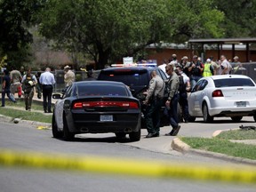 Law enforcement officers guard the scene of a shooting at Robb Elementary School in Uvalde, Texas, U.S. May 24, 2022.