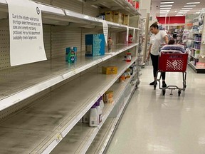 A woman shops for baby formula at Target in Annapolis, Maryland, on May 16, 2022, as a nationwide shortage of baby formula continues due to supply chain crunches tied to the coronavirus pandemic.