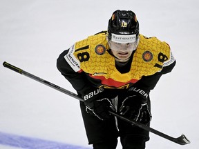 Germany's forward Tim Stuetzle grimaces during the IIHF Ice Hockey World Championships 1st Round group A match between France and Germany at the Helsinki ice Hall in Helsinki, Finland, on May 16, 2022.