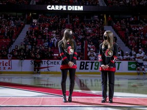 Anna Melnyk, left, and her sister Olivia Melnyk were in Ottawa for a Senators team photo and a pre-game ceremonial faceoff in late April.