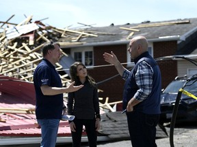 Ontario Liberal Party Leader Steven Del Duca speaks with Clarence-Rockland Mayor Mario Zanth as he tours the aftermath of a major storm in the community of Hammond with Liberal candidate for Glengarry-Prescott-Russell Amanda Simard.
