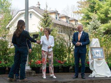 Her Royal Highness, Princess Margriet of the Netherlands, receives a tulip in front of Stornoway, her childhood home, for a ceremonial planting of tulips.