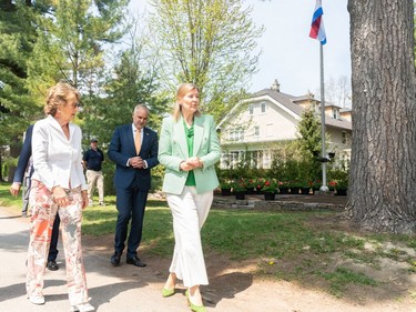 Her Royal Highness, Princess Margriet of the Netherlands, walks with the Ambassador of the Kingdom of the Netherlands, Ines Coppoolse, after the ceremonial planting of tulips at Stornoway, her childhood home.