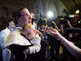 Then-democratic institutions minister Karina Gould talks to reporters as she carries her three-month-old baby, Oliver Gerones, in May, 2018.