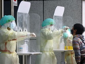 A person gets a coronavirus disease (COVID-19) test in Taipei, Taiwan, May 24, 2022.