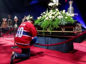 A fan pays his respects to late Montreal Canadiens ice hockey player Guy Lafleur, during visitation at the Bell Centre in Montreal, Canada, May 2, 2022.