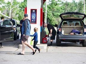 Aftermath of storm, May 22, 2022
The Esso station at Hunt Club and Conroy roads was open on Sunday morning, May 22, 2022. There were lineups with people filling containers with gas.