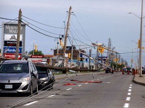 Merivale Road near Viewmount drive. Cars are trapped under wires with many down poles. Merivale Road is also closed in this area.