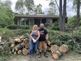 Siblings Beth and Duane Faris in front of their parents' home in the Pineglen neighbourhood, hit hard by Saturday's storm.