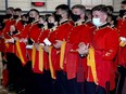 Officer cadets at the Royal Military College convocation on Thursday applaud for their four classmates who were killed in a vehicle accident last month.