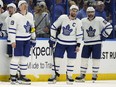 Toronto Maple Leafs center Jason Spezza (19), center John Tavares (91), and defenseman Mark Giordano (55) react after the Tampa Bay Lightning center Brayden Point scored the game-winning goal during sudden-death overtime in Game 6 of an NHL hockey first-round playoff series Thursday, May 12, 2022, in Tampa, Fla.