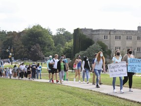 Western University students march during a walkout in support of sexual assault survivors, in London, Ont., Friday, Sept. 17, 2021.&ampnbsp;Western University says it's introducing new measures and enhancing existing resources to address gender-based and sexual violence in order to provide a safe campus environment for all.