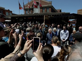 Prince Charles and Camilla, Duchess of Cornwall, visit the ByWard Market in Ottawa Wednesday.