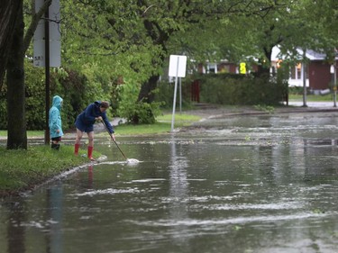 A powerful storm rolled through Ottawa Saturday, downing trees and flooding streets.