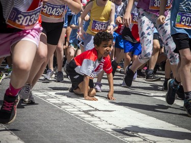 Children race off the start line for the Kids Marathon.